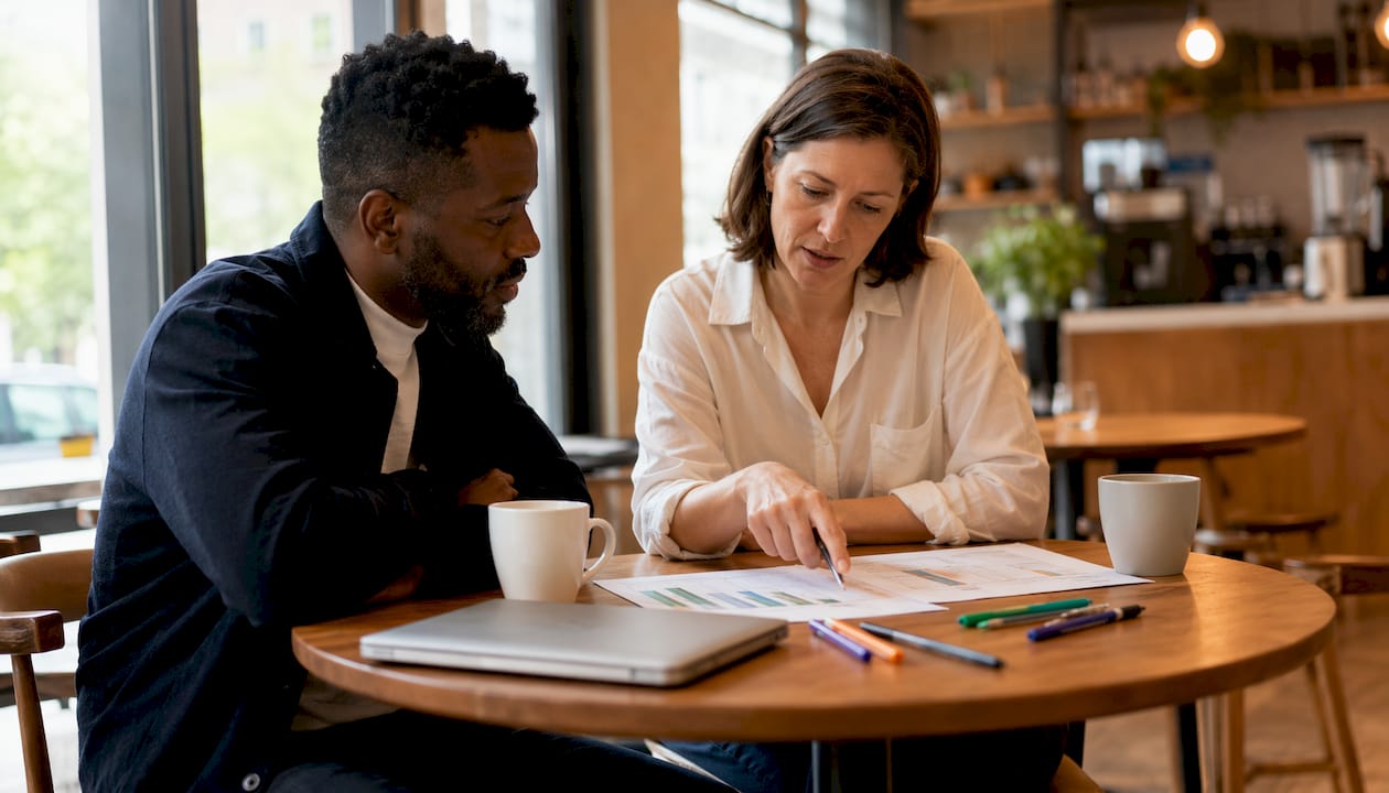 Two experts discussing digital audit documents