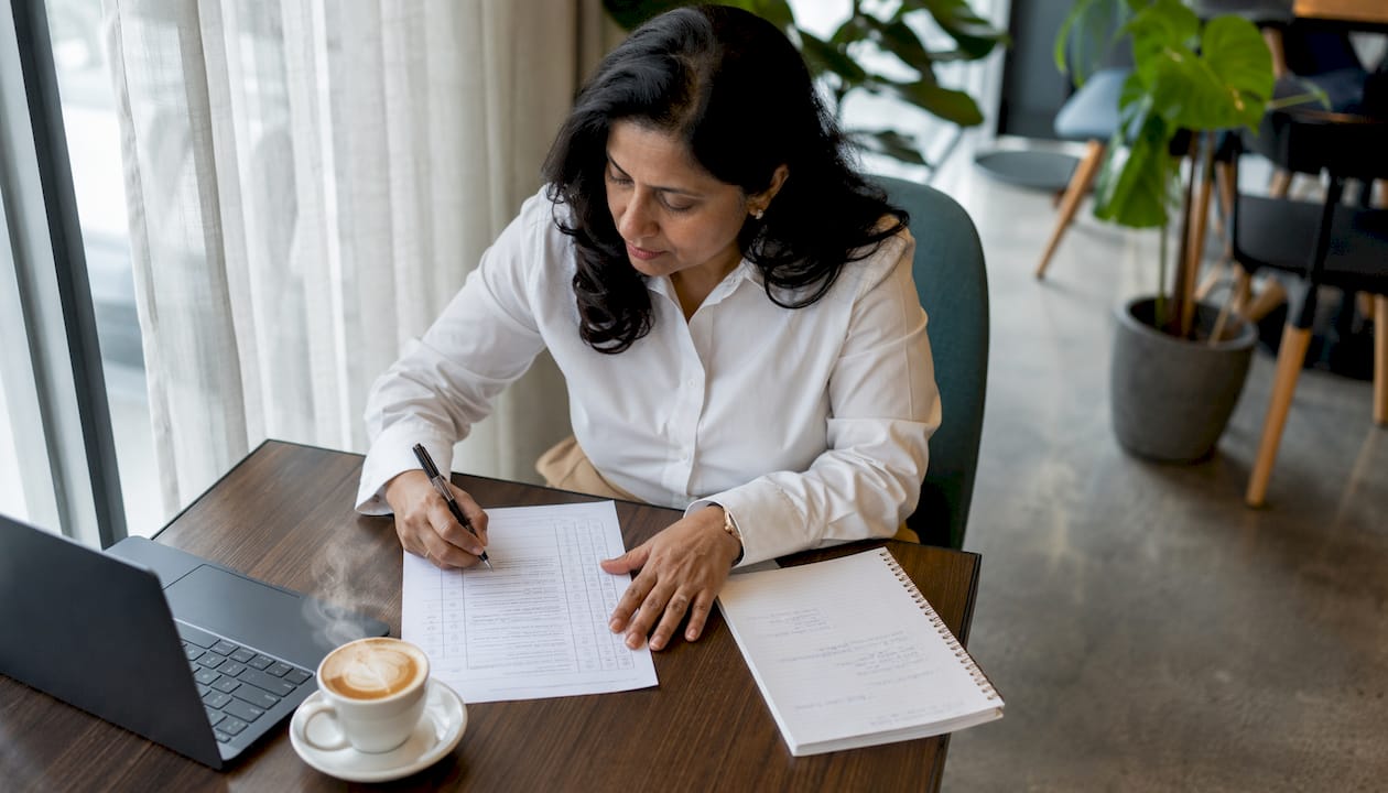 Woman assessing marketing skills in home office