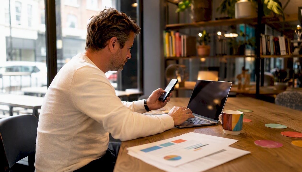 Businessman managing email and SMS drip campaigns