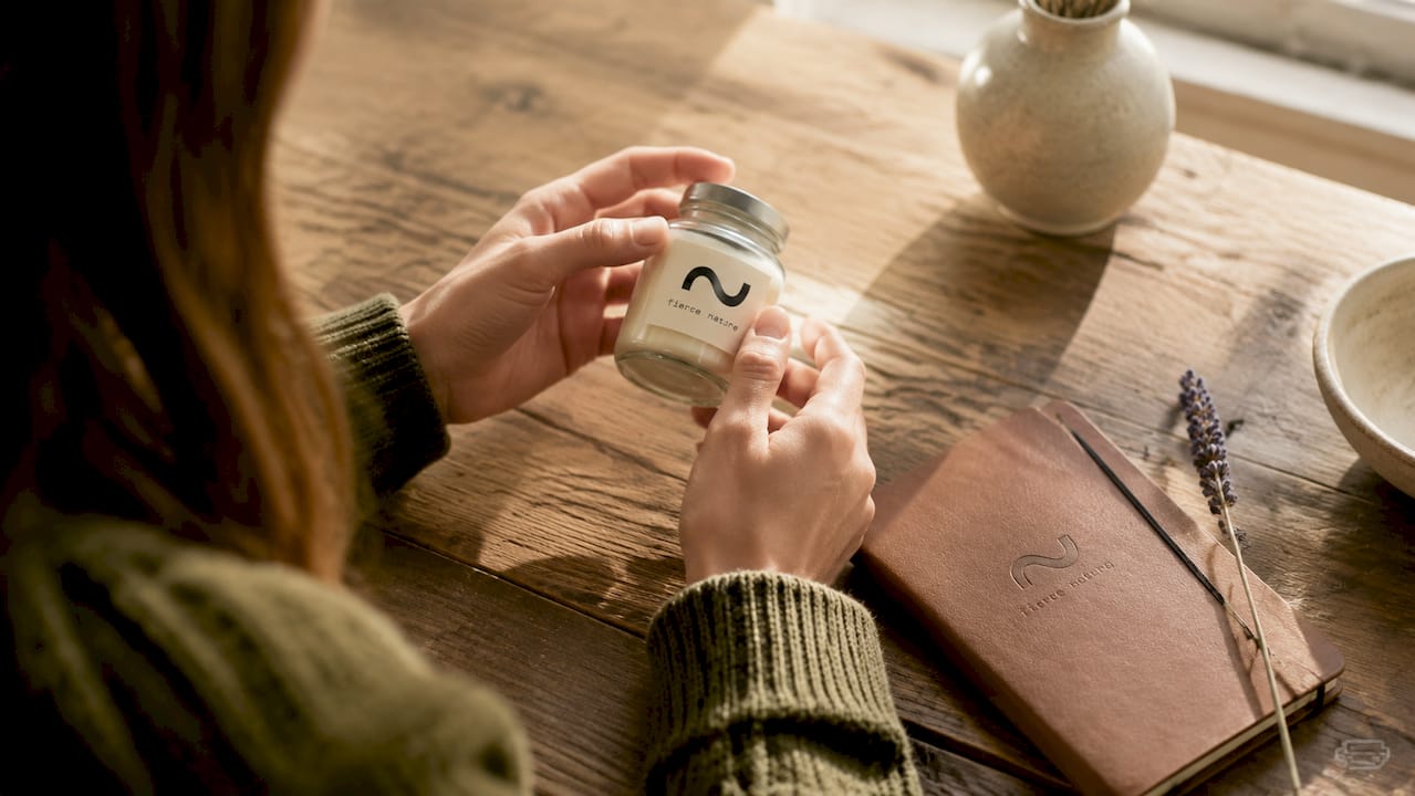 Hands checking cosmetic ingredient label closely