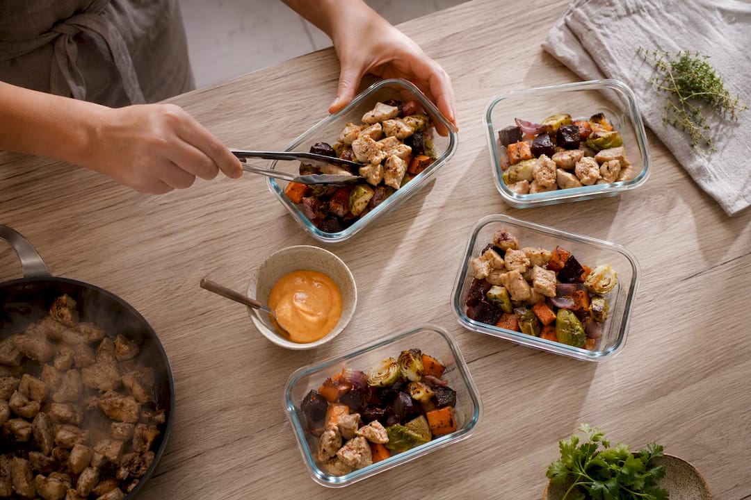 Fresh paleo meals cooling in shallow containers