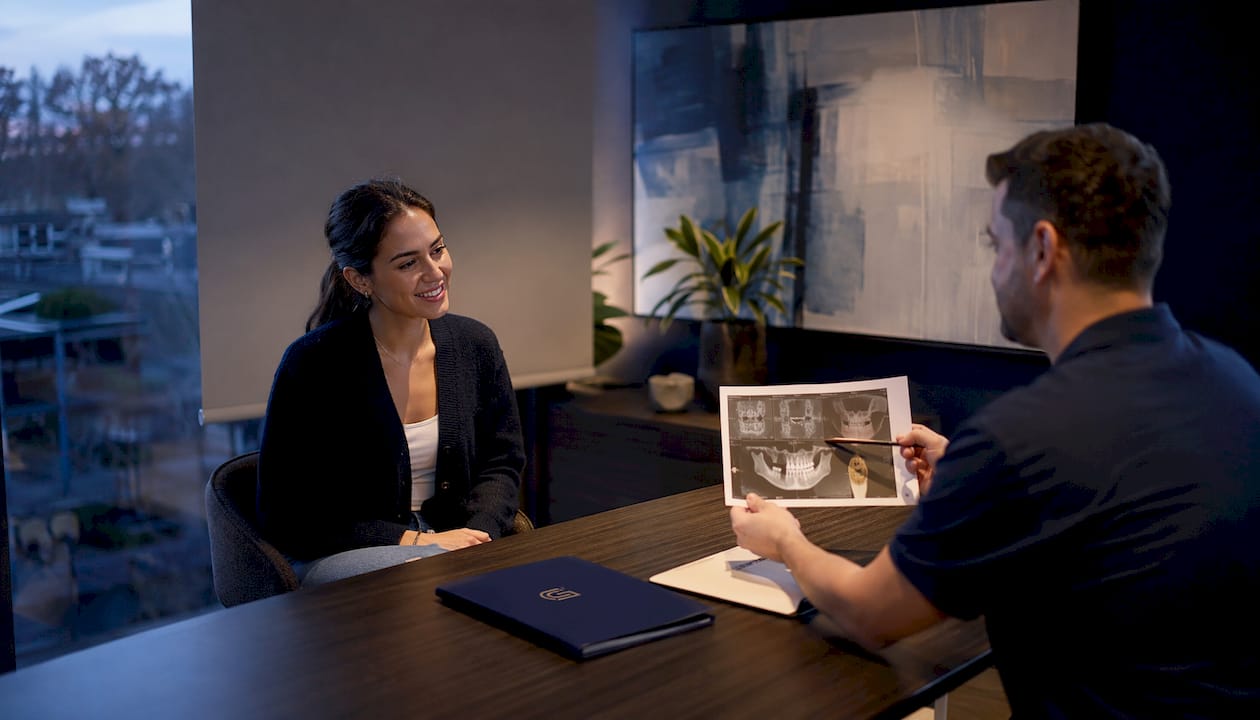 Patient reviewing dental consultation documents