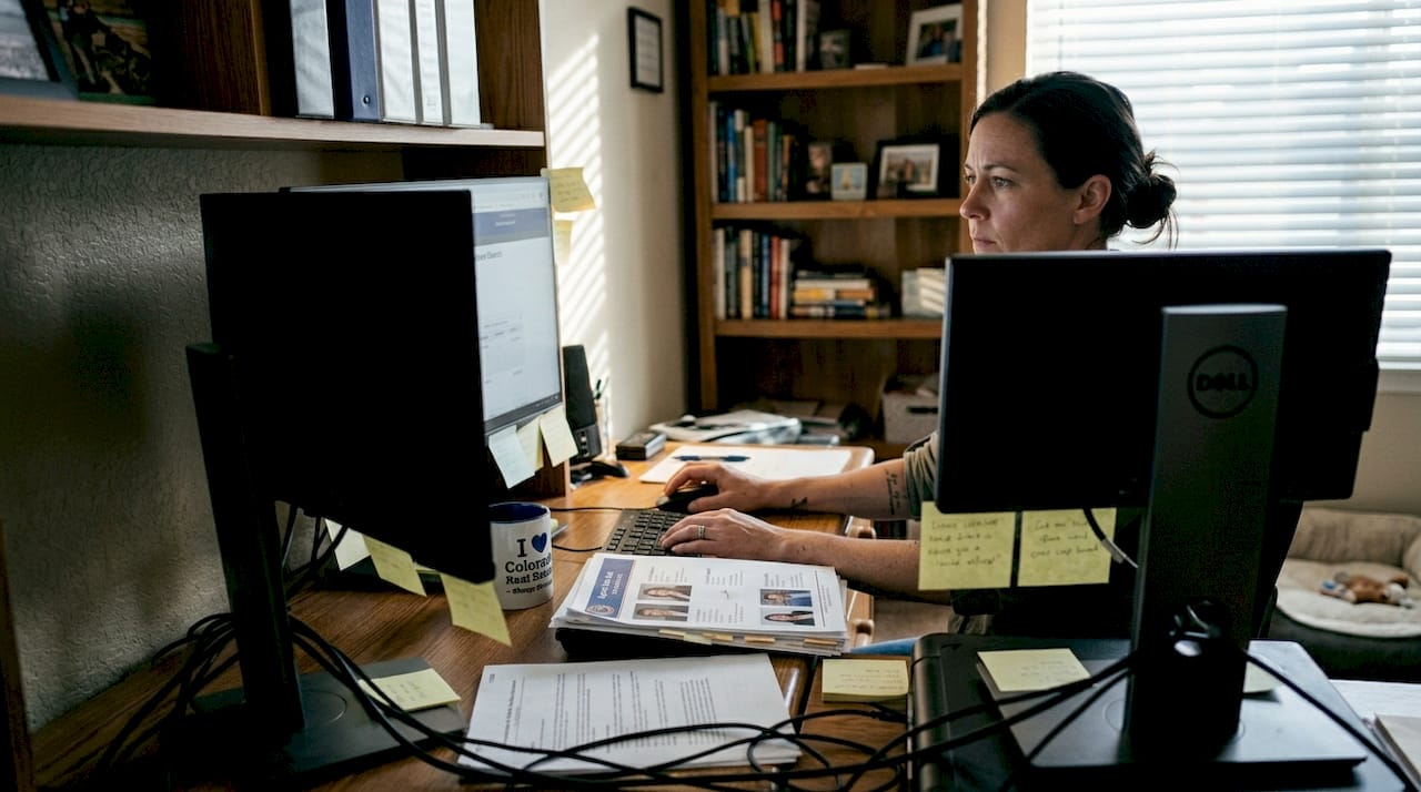 Woman checks Colorado real estate license database