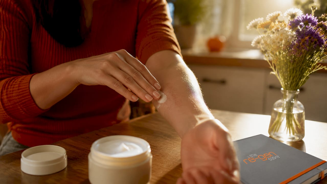 Woman applying vitamin E cream on scar