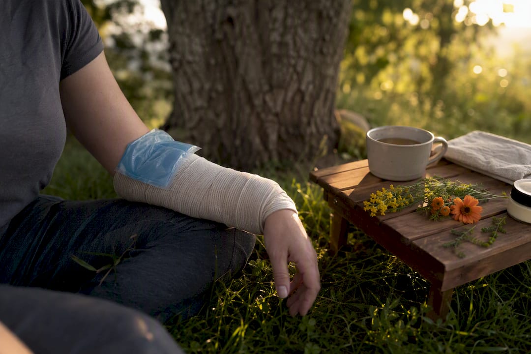 Arm resting with ice compression bandage