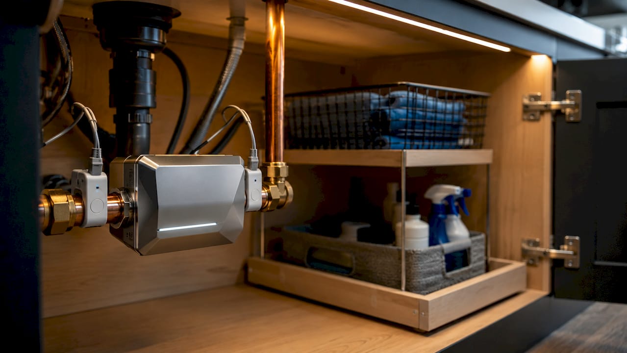 Close-up of smart water shutoff valve under sink
