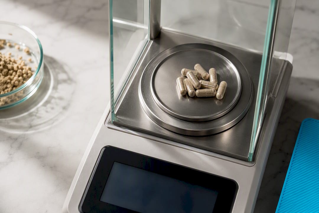 Anonymous capsules on a precision weighing scale