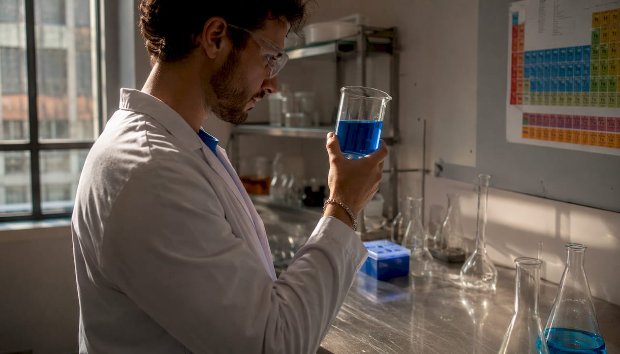 Hands calculating peptide concentration