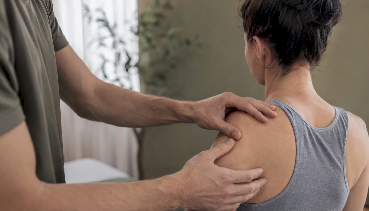 Therapist's hands performing muscle release therapy