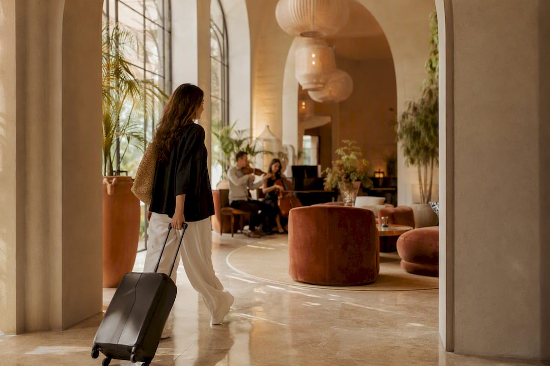 Guest crossing luxury hotel arrival threshold