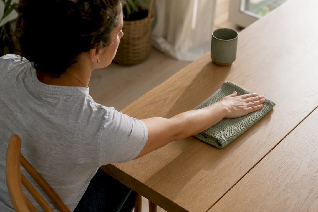 Patient performing supported forearm table slides