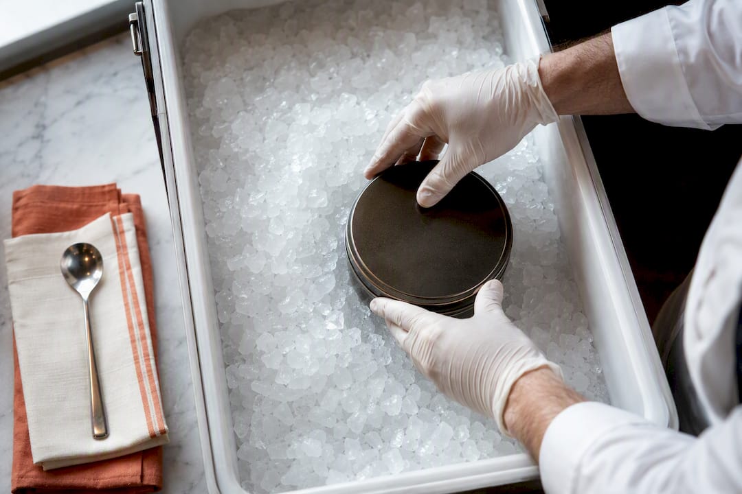 Caviar container kept cold on continuous ice
