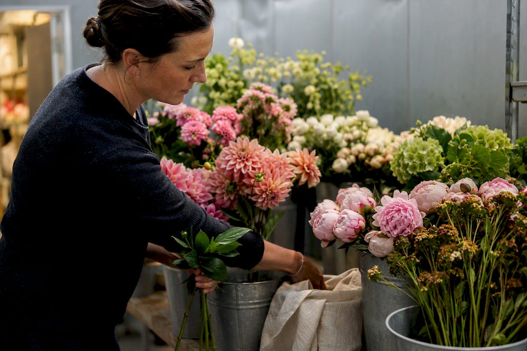 Designer sorting seasonal luxury flower stems