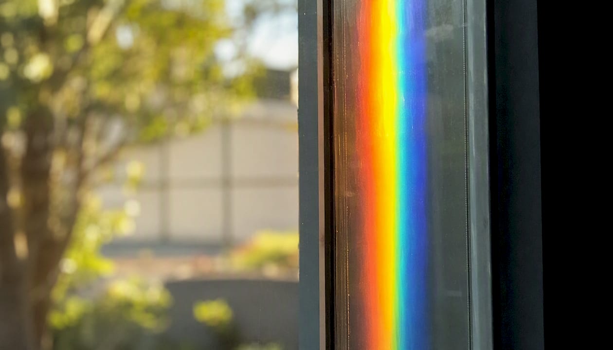 Gradient of visible light spectrum colors on glass