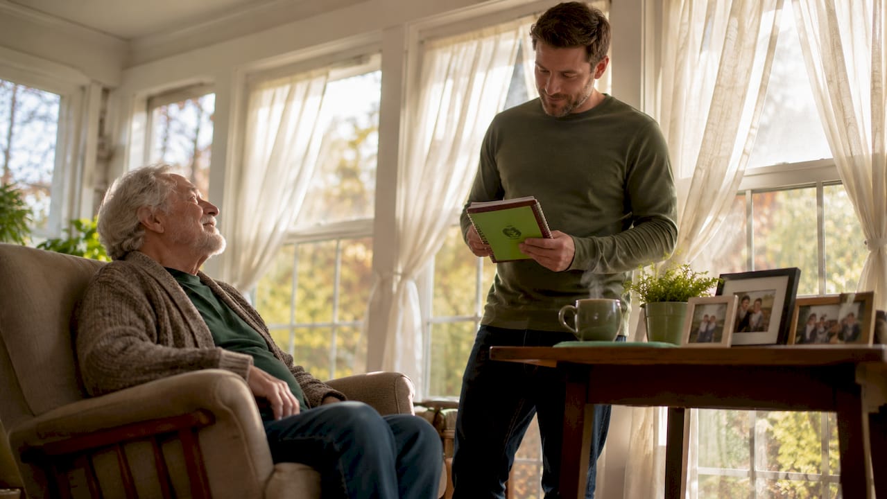 Adult son preparing to talk with elderly father at home kitchen