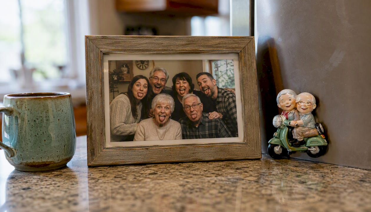 Framed funny family photo on kitchen counter