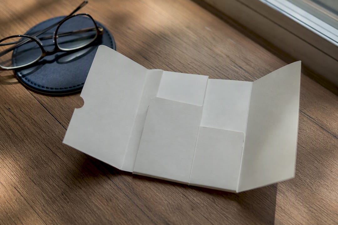 Folded wallet medication card on desk
