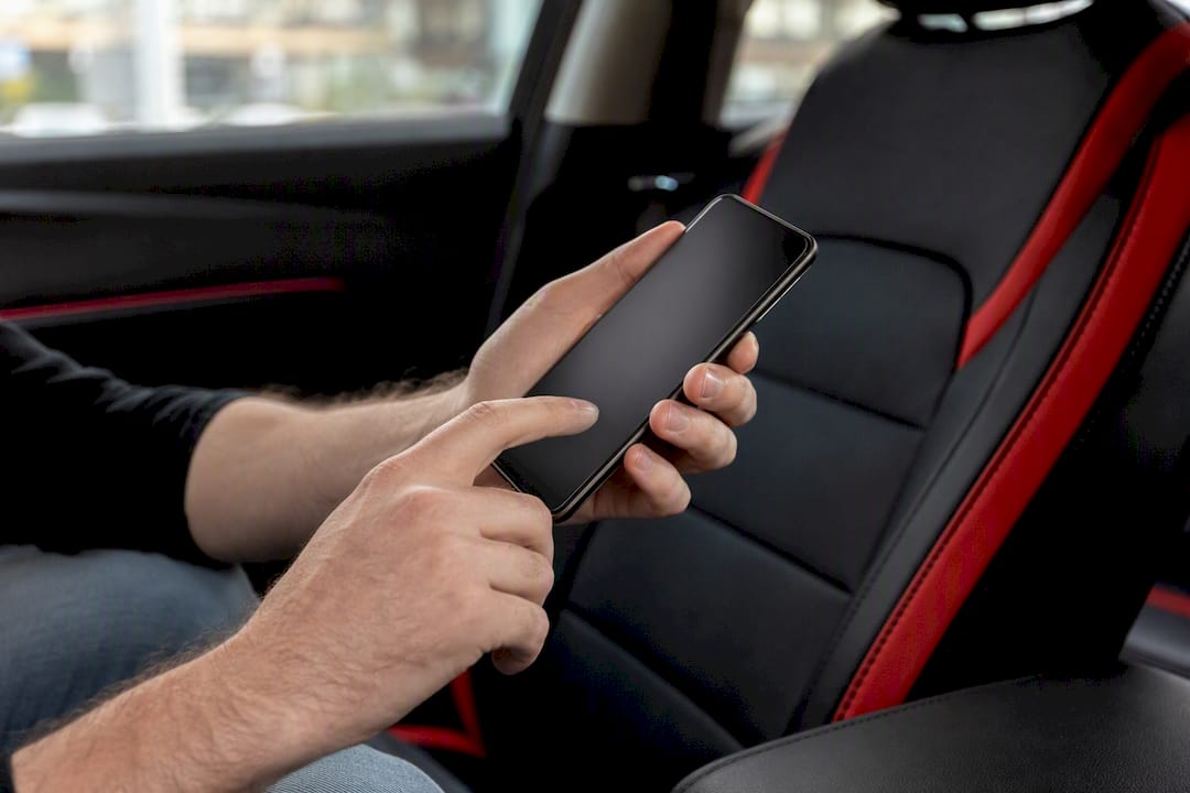 Hands authorizing finance digitally on smartphone