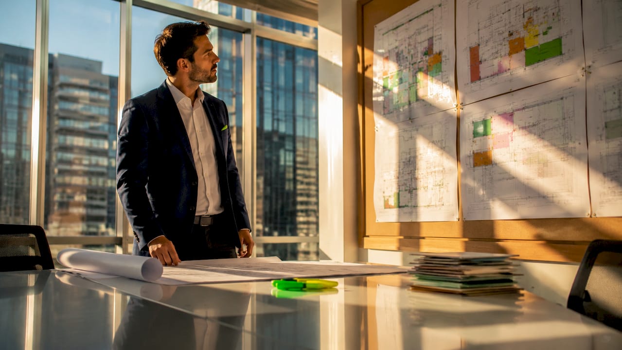 Project manager reviewing office renovation plans