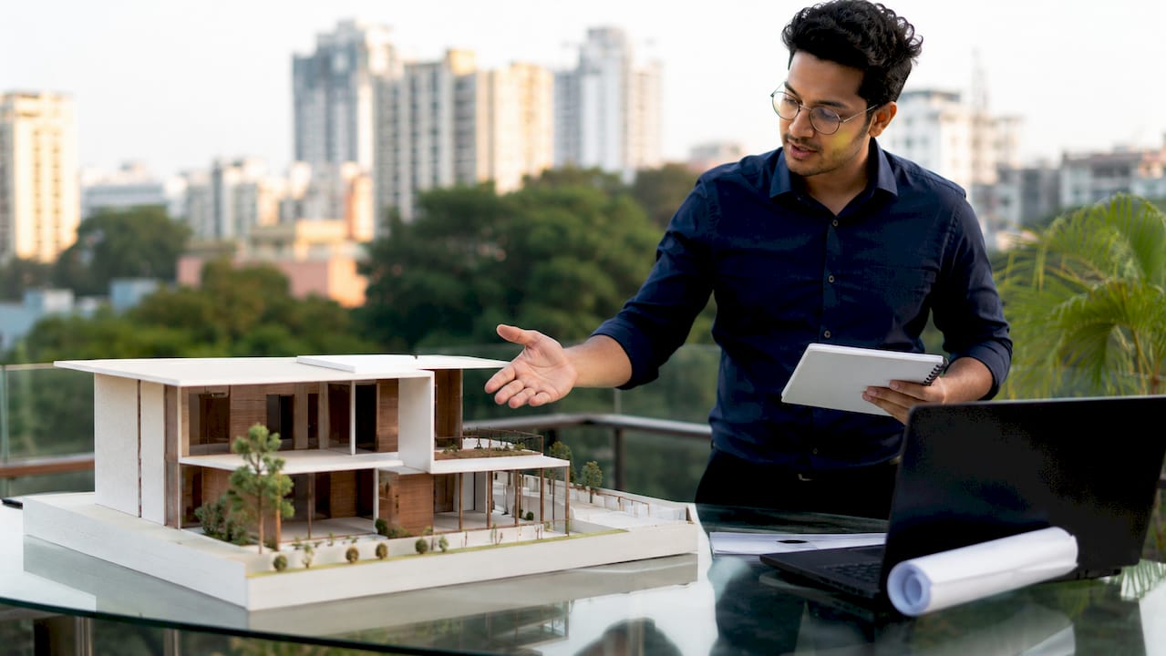 Architect explaining house addition model