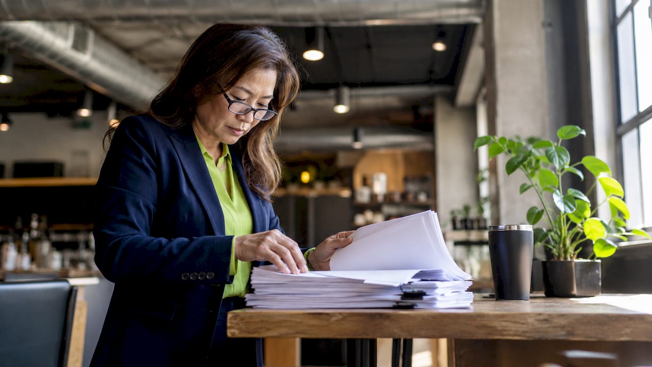 Property manager reviewing compliance documents