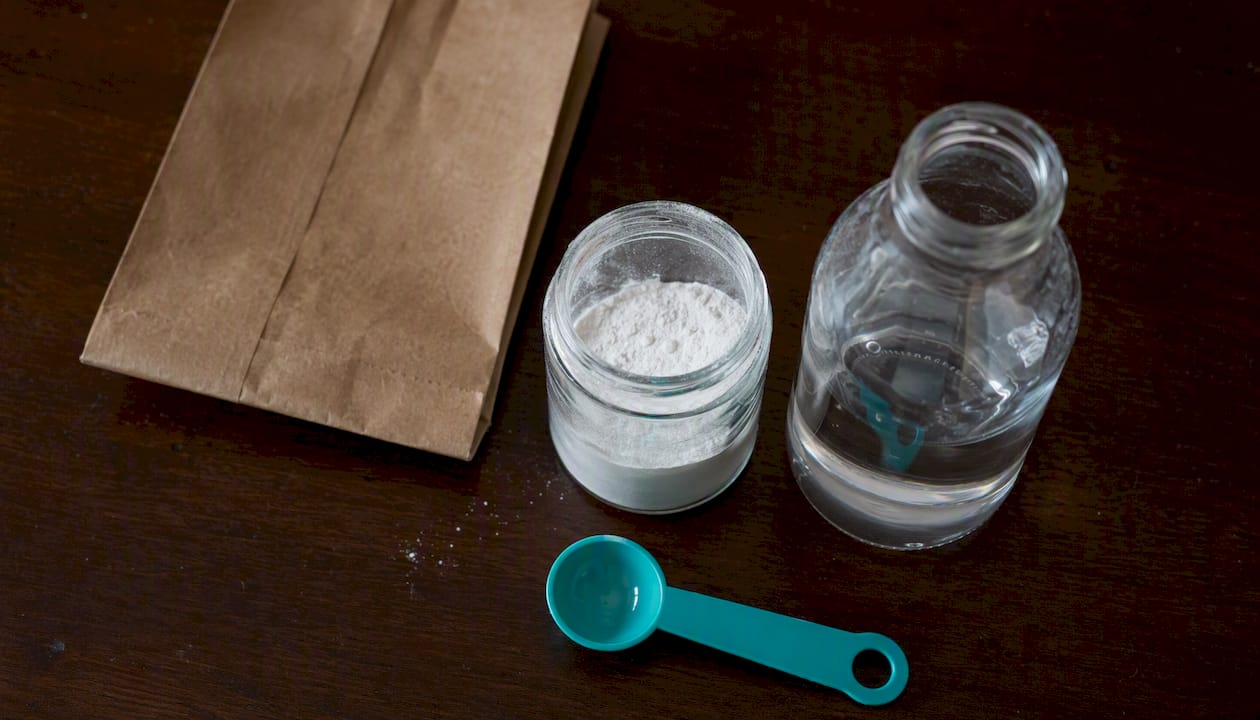 Close-up of manganese dioxide powder and H2O2 bottle