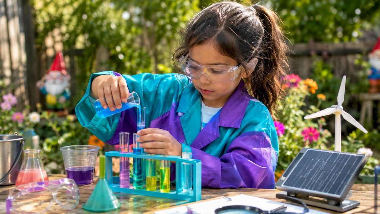 Child role-playing scientist doing experiment