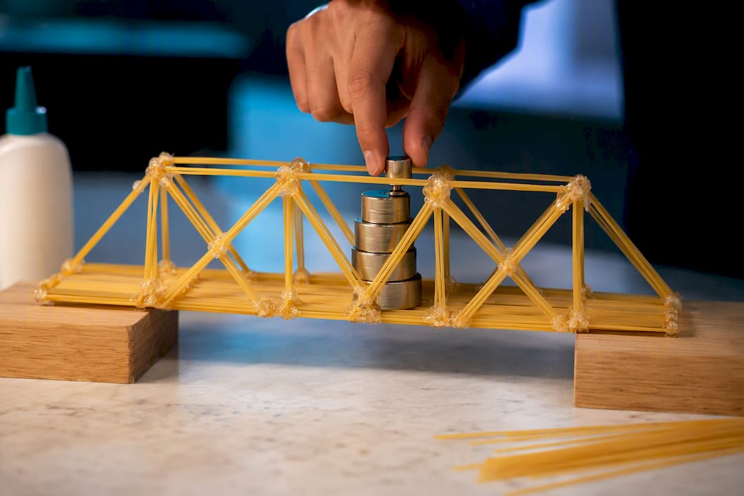 Spaghetti truss bridge under gradual load