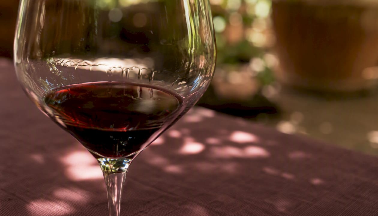 Close-up of legs in wine glass
