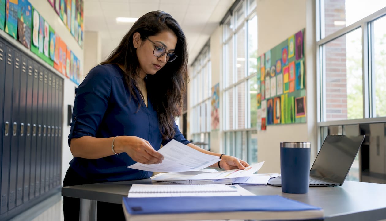 Woman reviewing school cybersecurity assets