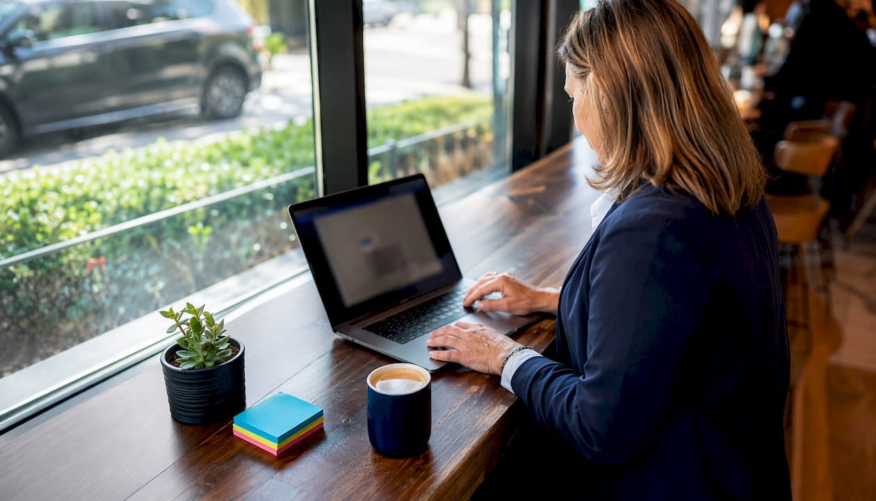 Middle-aged woman reviewing digital privacy settings