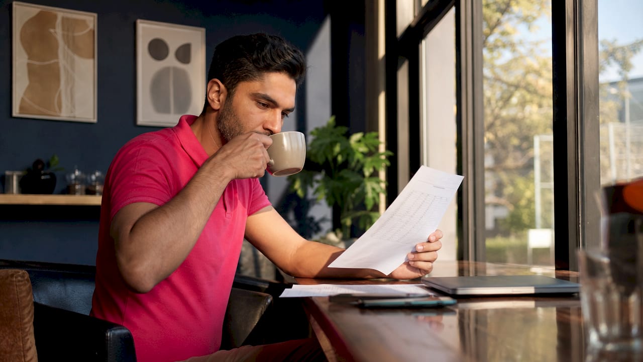 Man reviewing printed fertility test results