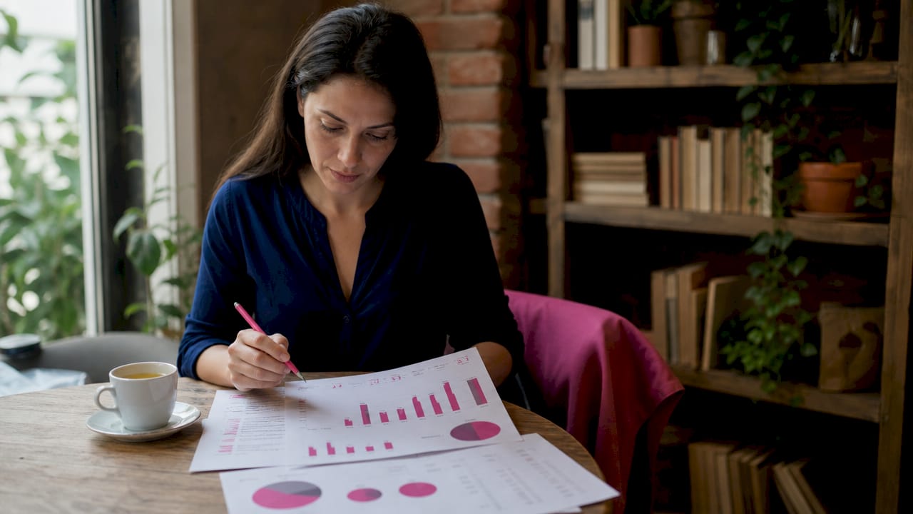 Woman reviewing IVF success rate charts at home