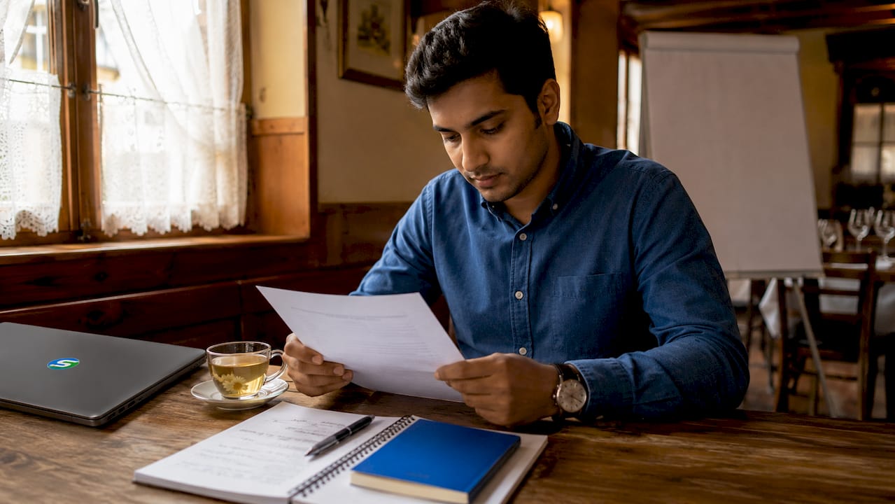 New restaurant staff member reading onboarding plan
