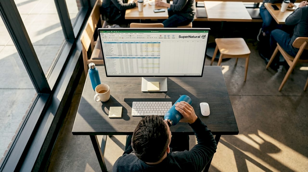 Office worker with supplement organizer at desk