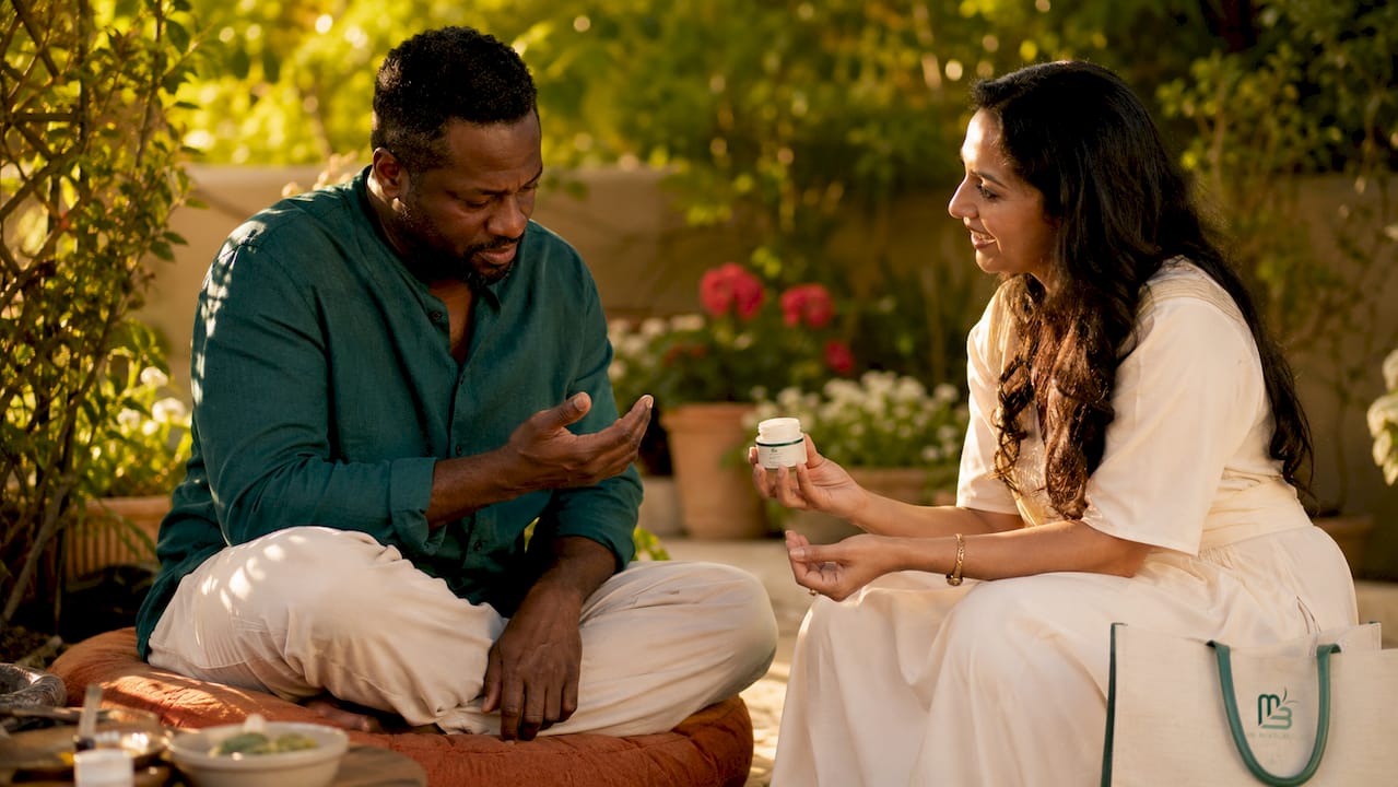 Dermatologist consulting middle-aged man about skin