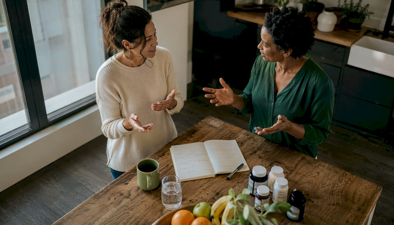 Two people discuss supplement options