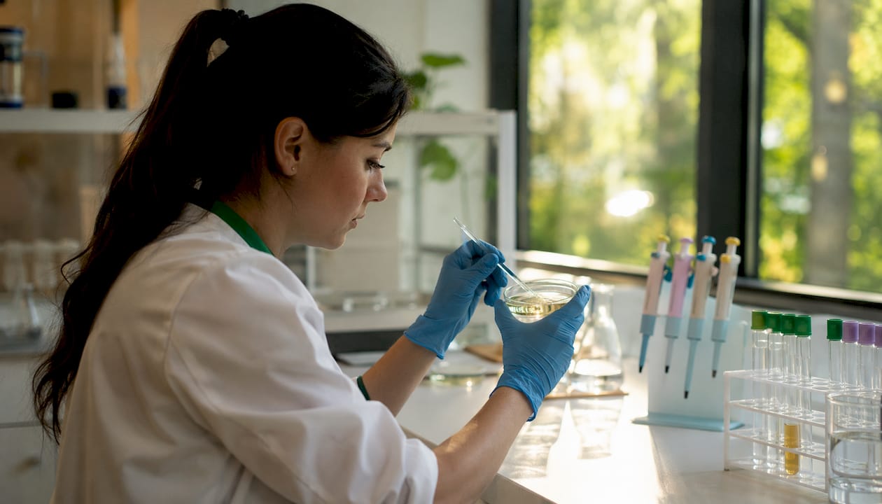 Scientist mixing micelle solution in laboratory