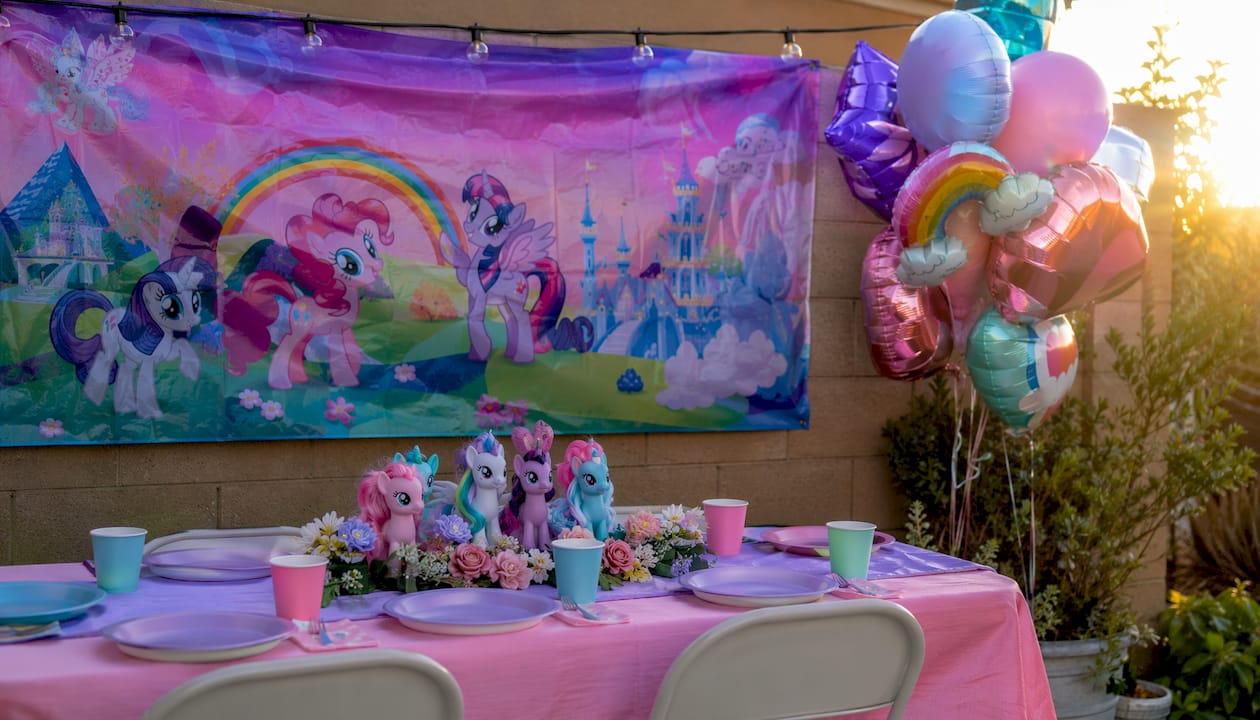 My Little Pony banner and balloon decoration setup