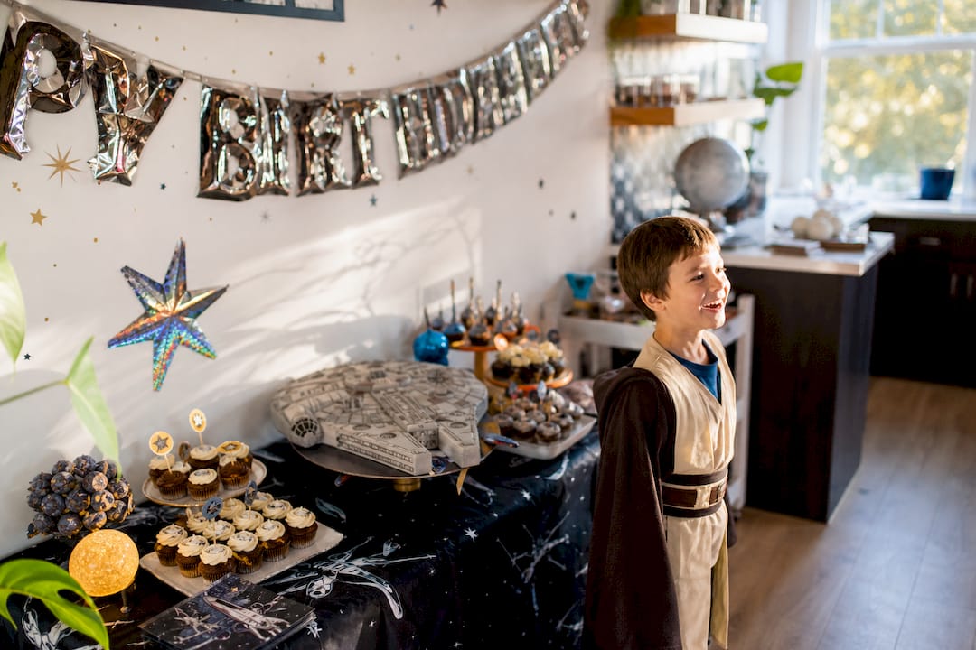 Star Wars foil banner and themed dessert table