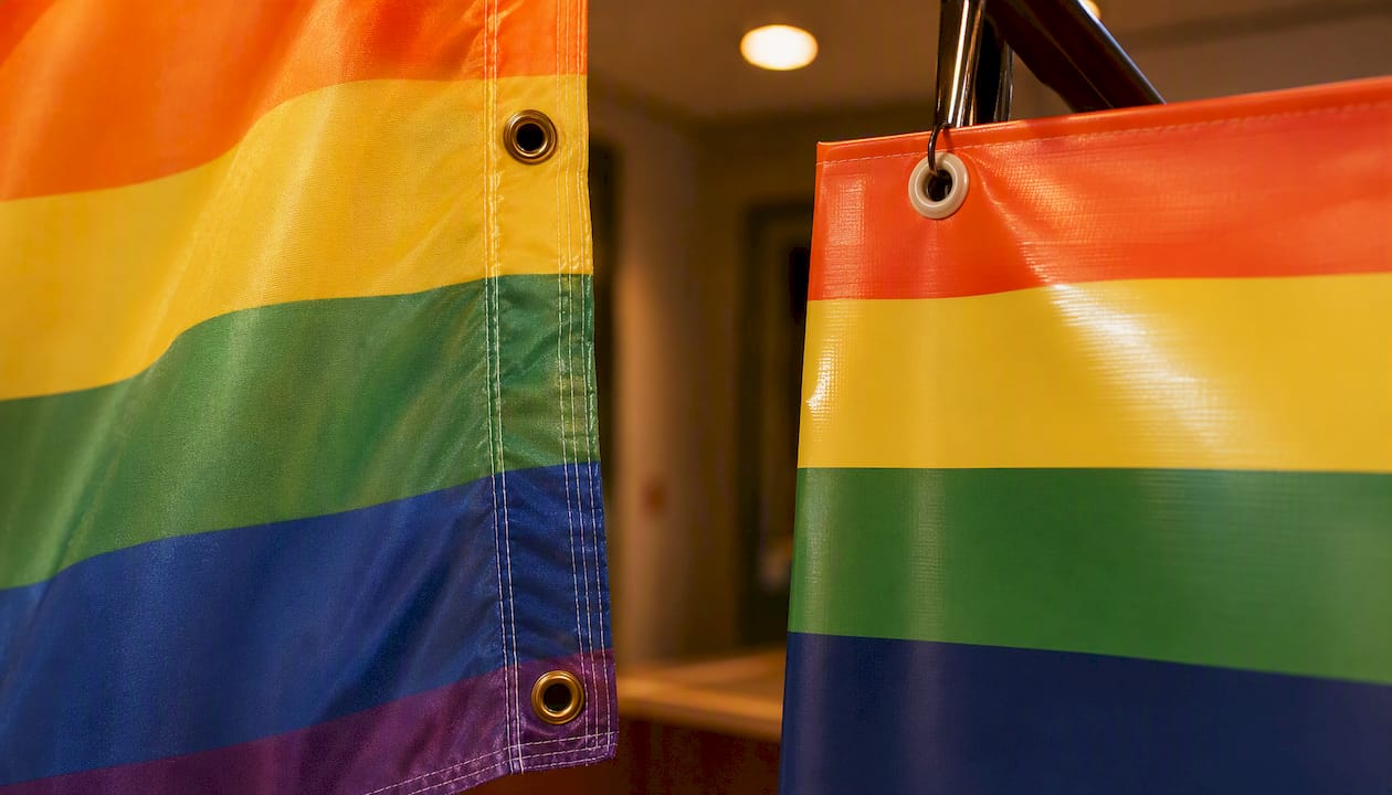 Close-up of fabric flag and vinyl banner edges