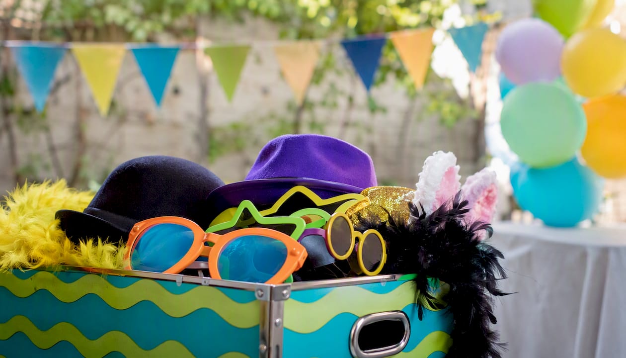 Basket of colorful photo booth props at party