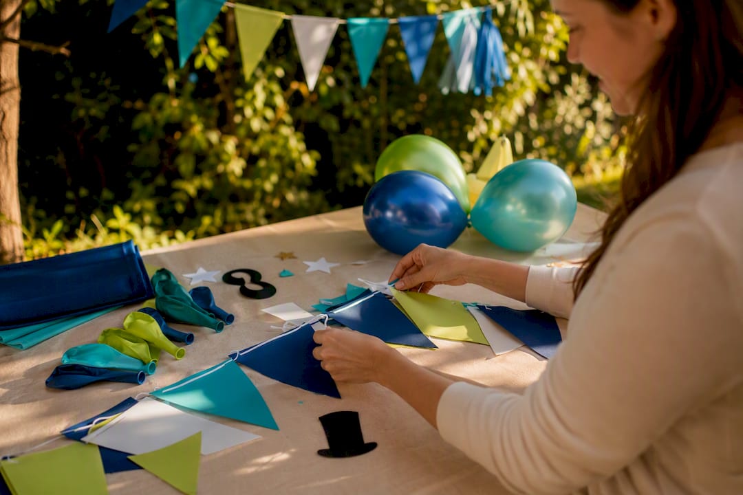 Hands arranging reusable festive decor accents