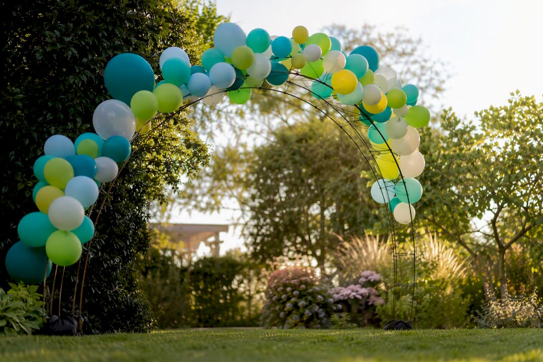 Wire frame holding air-filled balloon cluster indoors