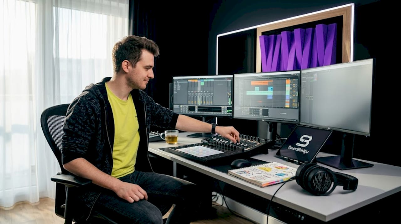 Audio producer working at DAW setup