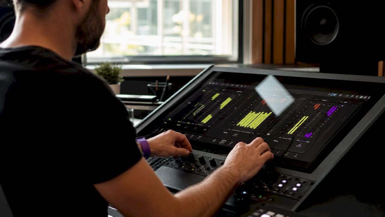 Close-up of hands using digital loudness meter