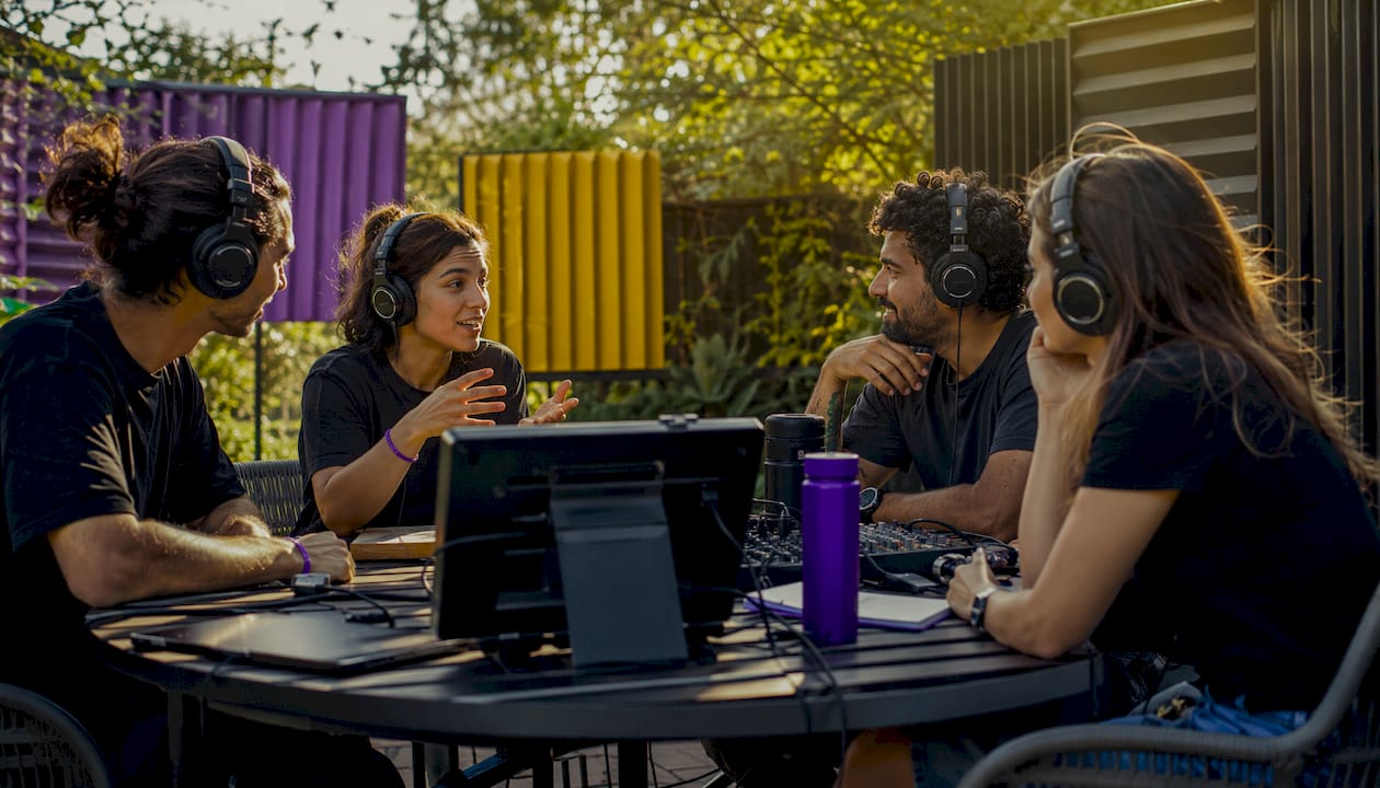 Audio team collaborating in virtual studio