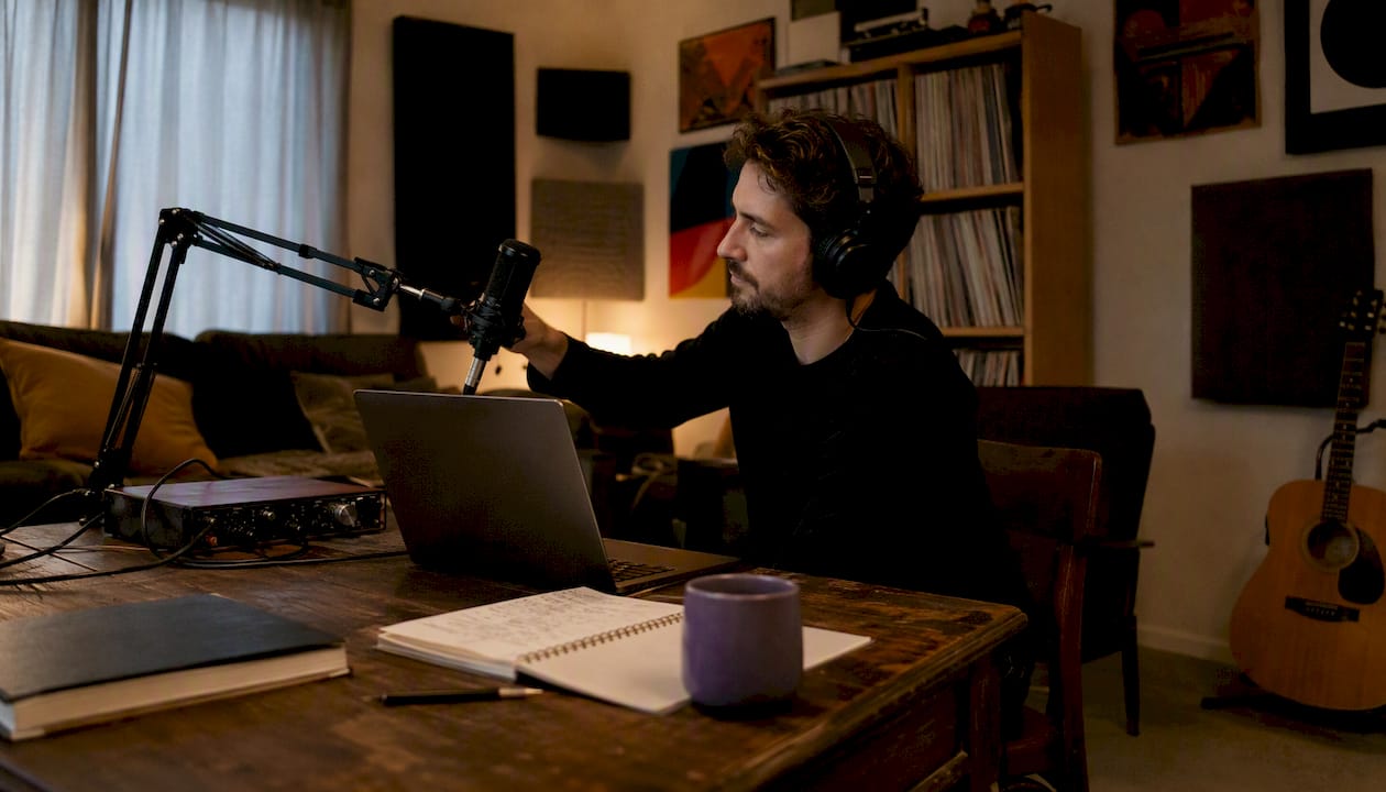 Music producer in home studio setting up remote vocal session