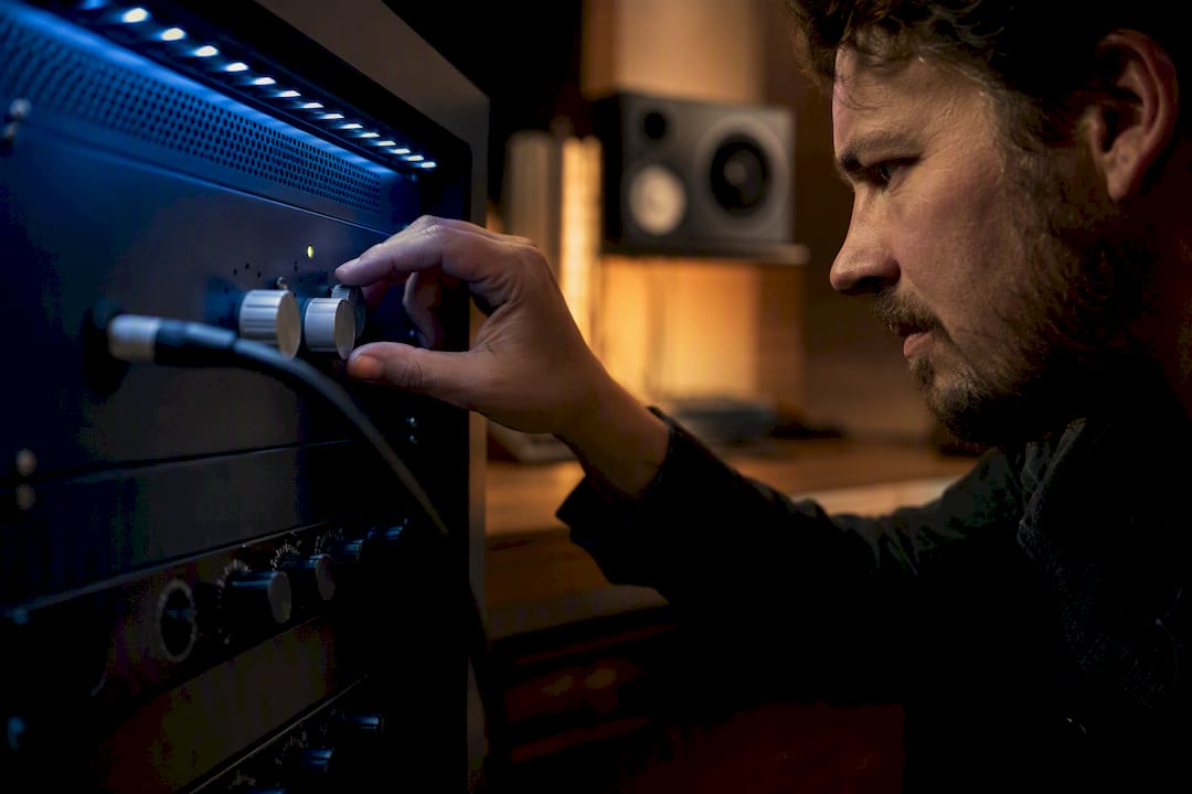 Engineer checking an audio converter signal chain