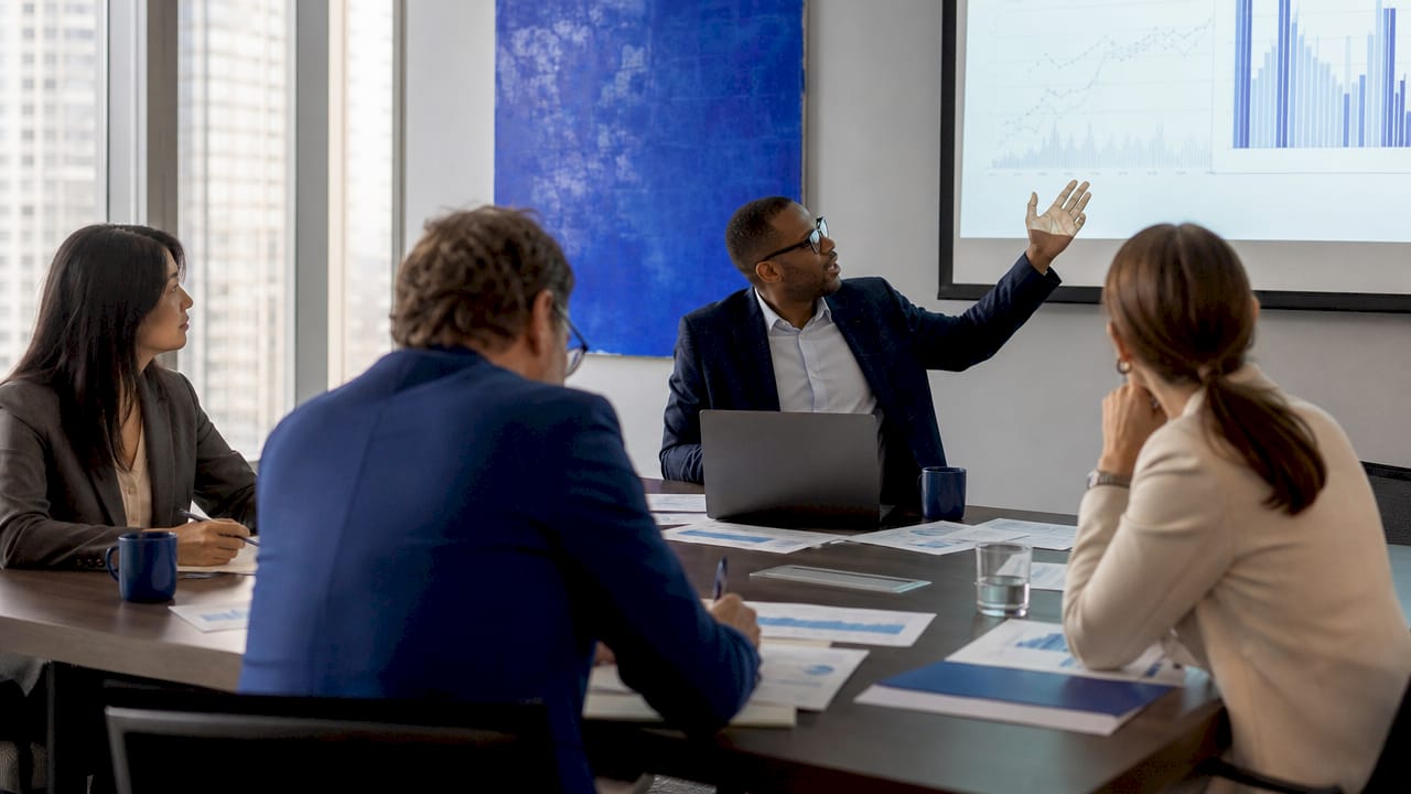 Group of investors collaborating in conference room